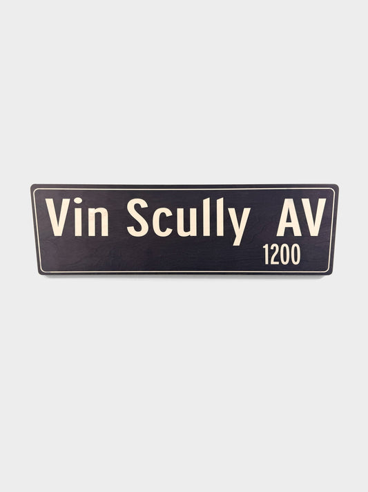 Pacific Stranded Vin Scully AV 1200 street sign, dark blue with cream lettering, 30" wide.