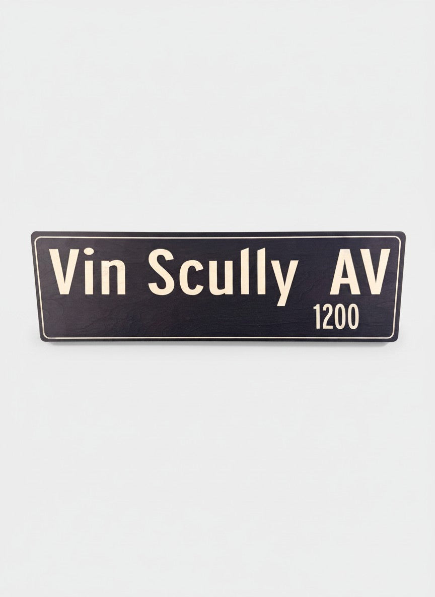 Pacific Stranded Vin Scully AV 1200 street sign, dark blue with cream lettering.